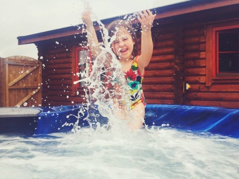 girl splashing in jacuzzi