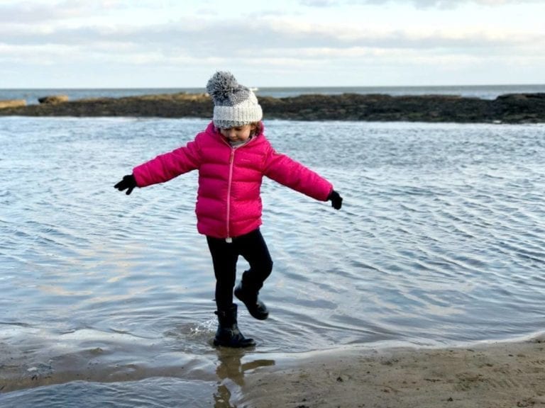 Playing on the beach at Robin Hood's Bay