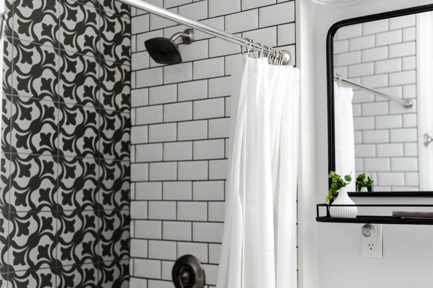 black and white bathroom with tiles and white shower curtain