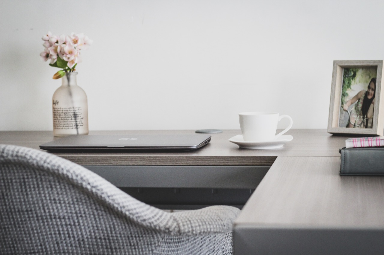desk with laptop chair and coffee cup