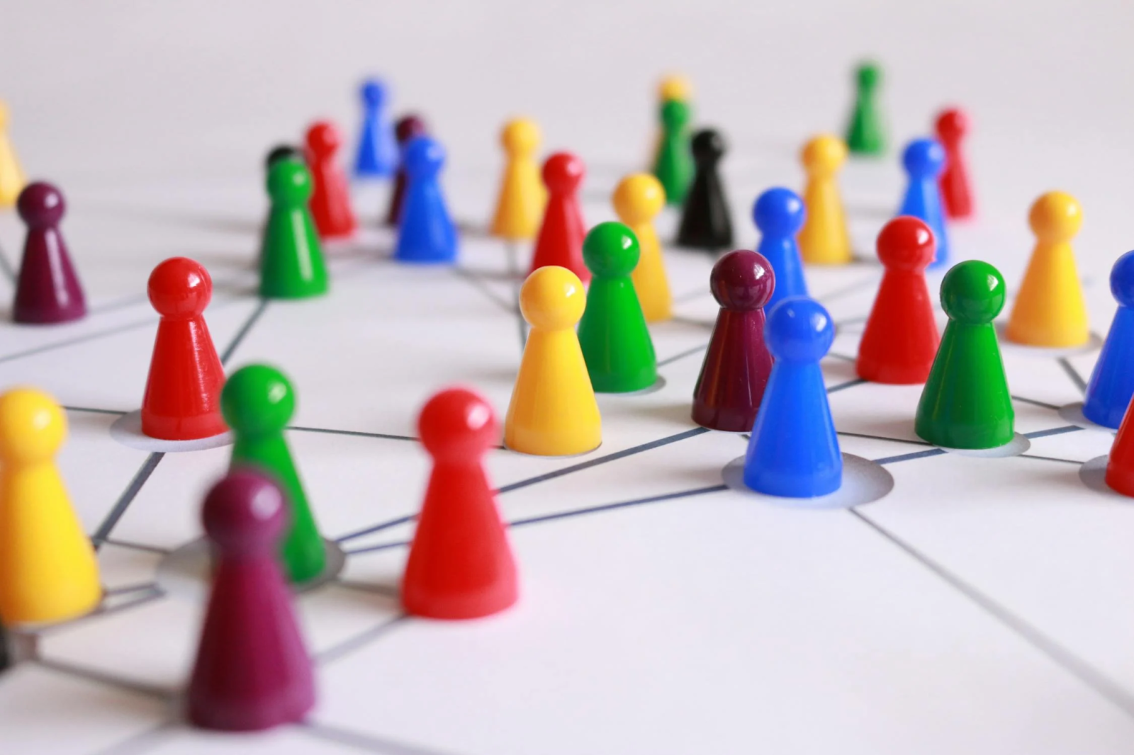 coloured games counters on white board