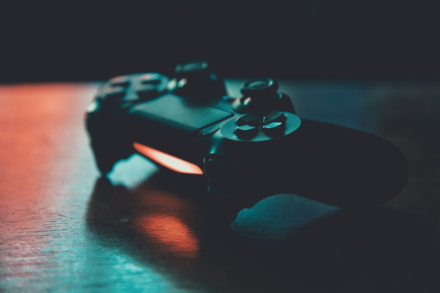 gaming  control handset on table in dark light