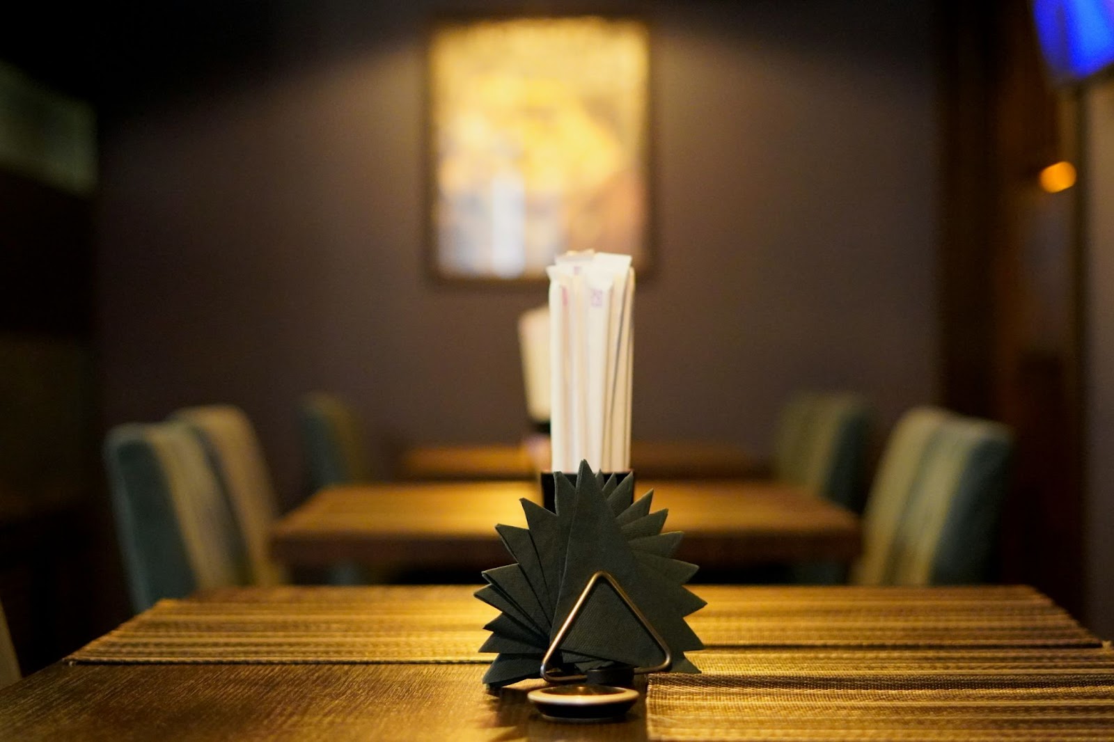 tables and chairs inside a restaurant