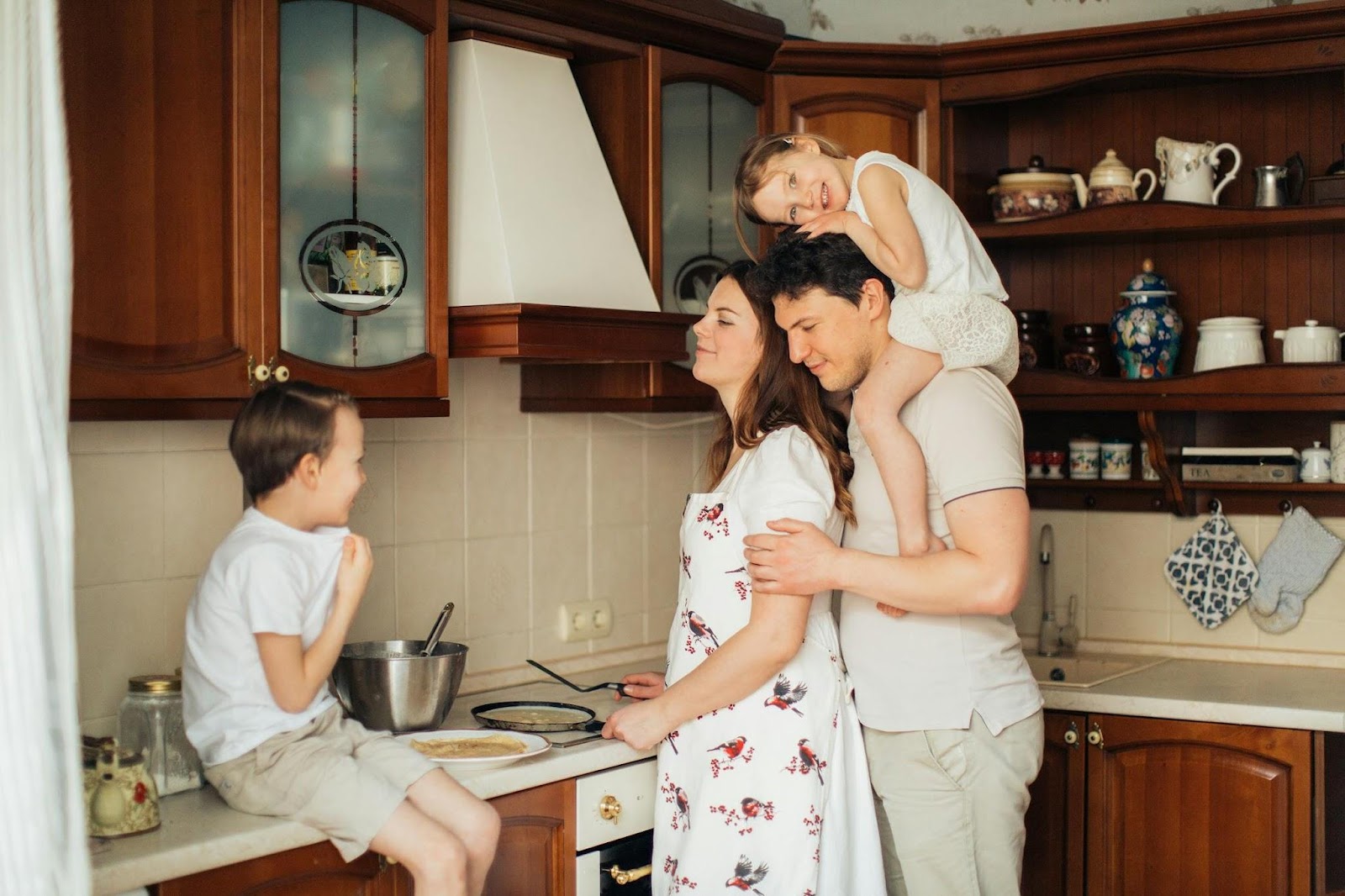 family together in kitchen smiling