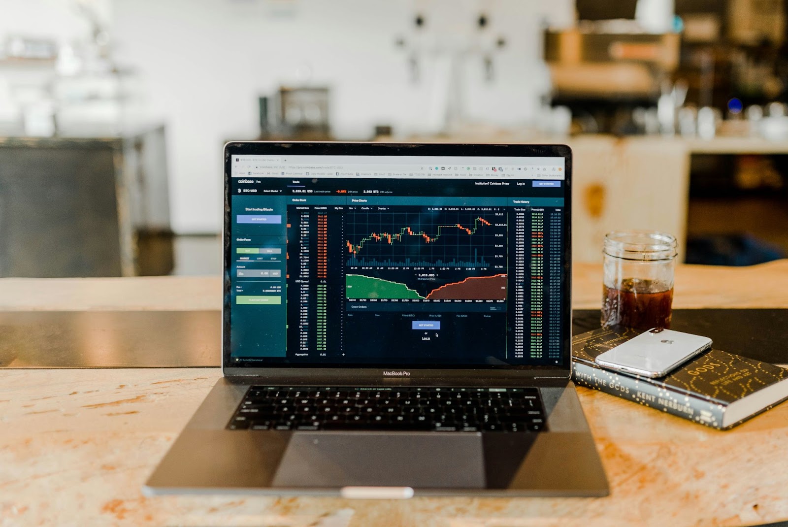 open laptop on table with charts on screen