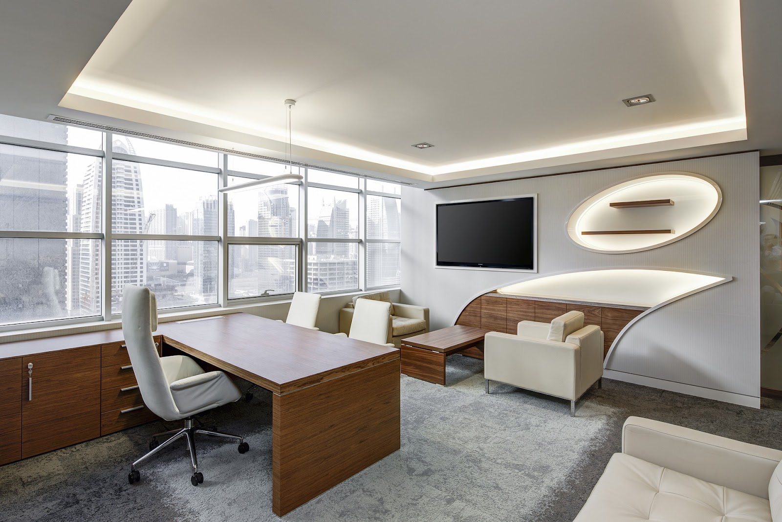 large modern office with lots of windows and buildings outside