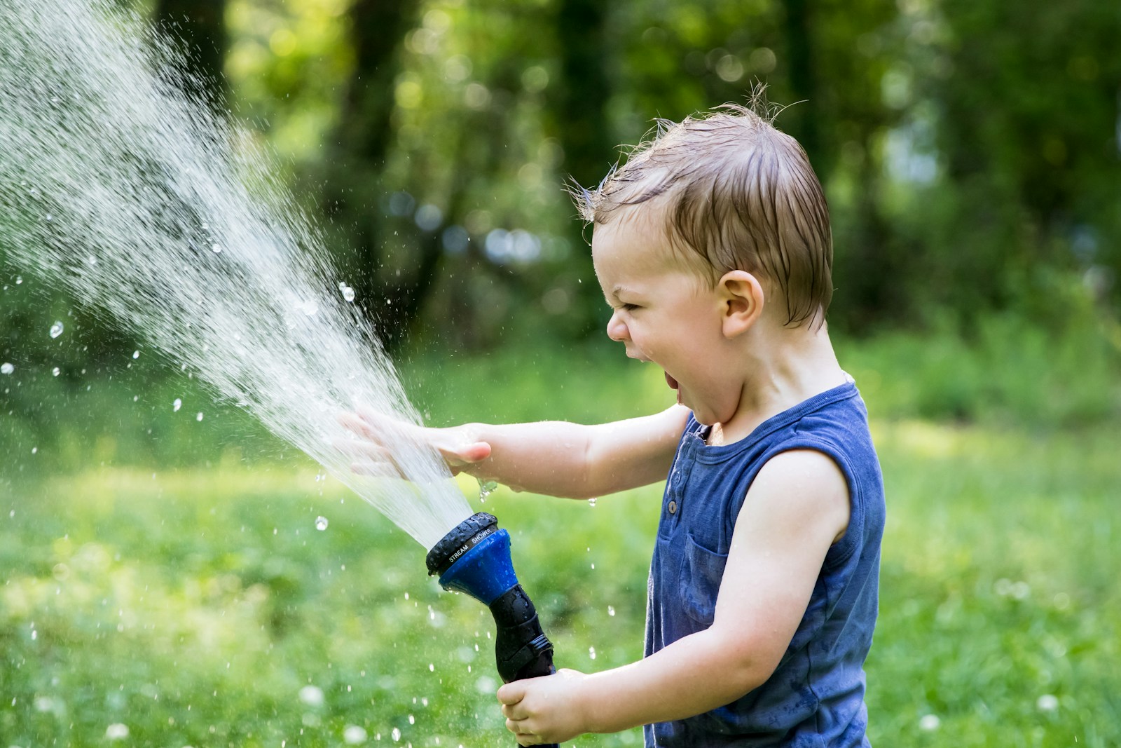 toddler playing with water