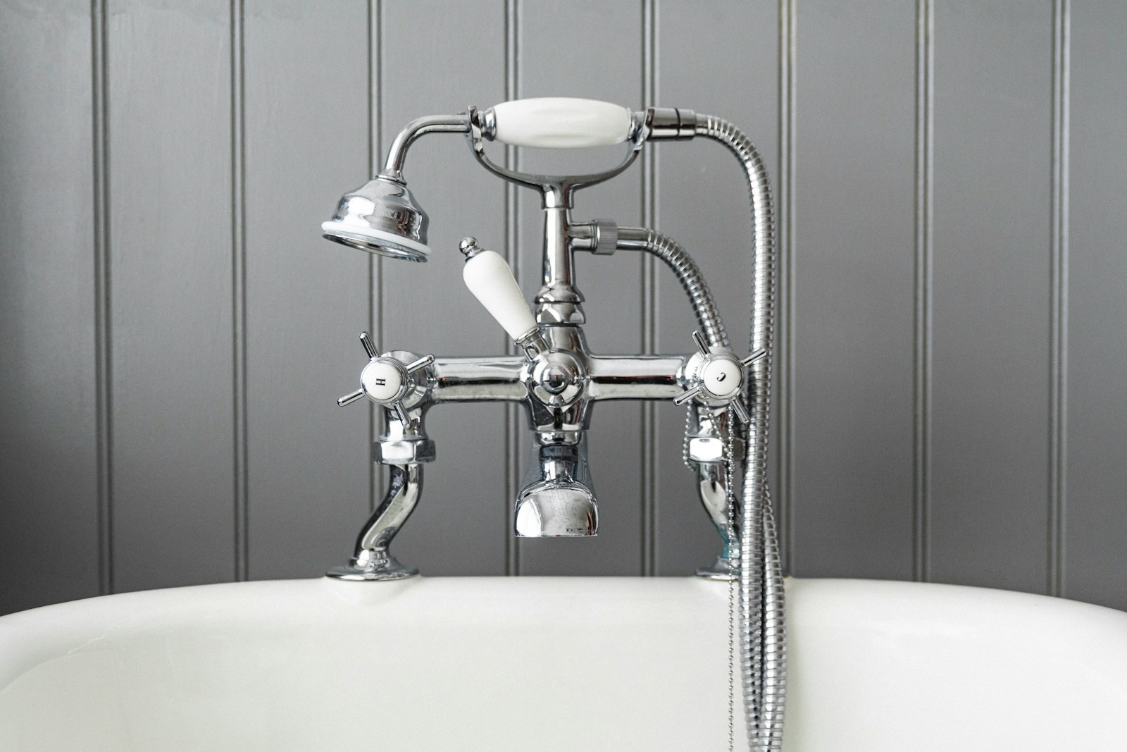 grey and white stainless steel bath taps and shower