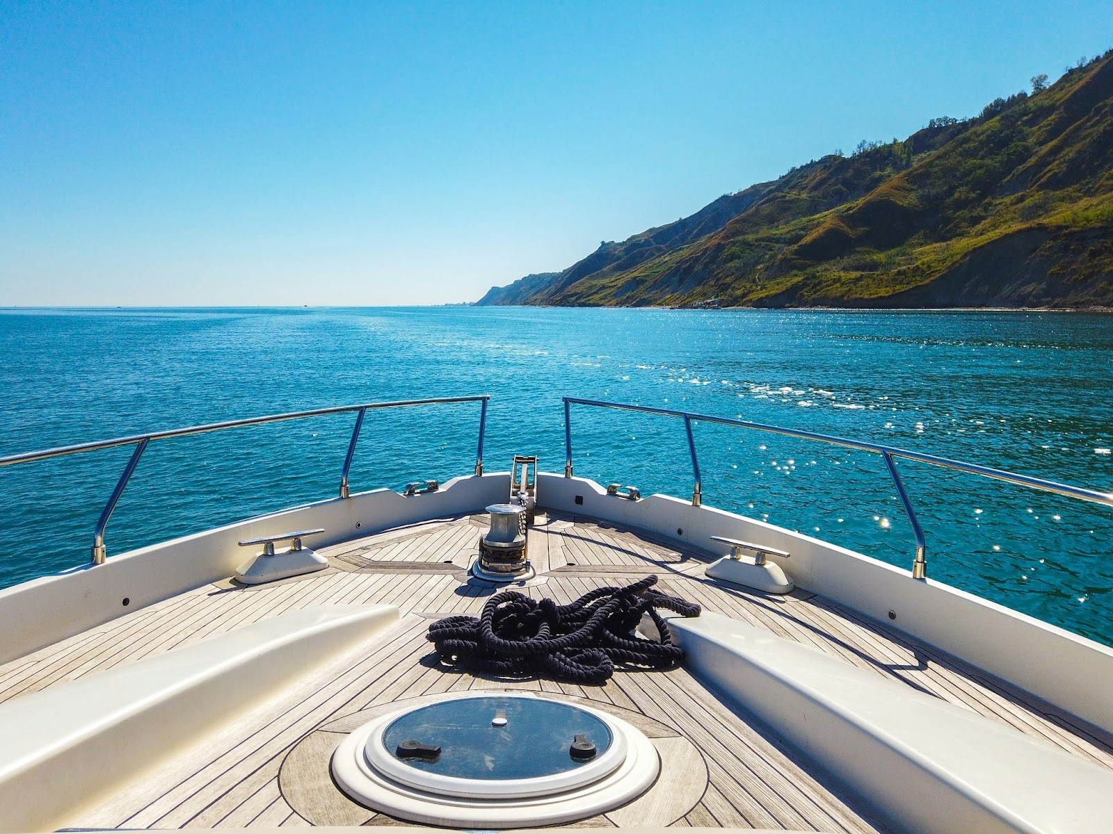 bright blue sea and sky with view from boat on the water