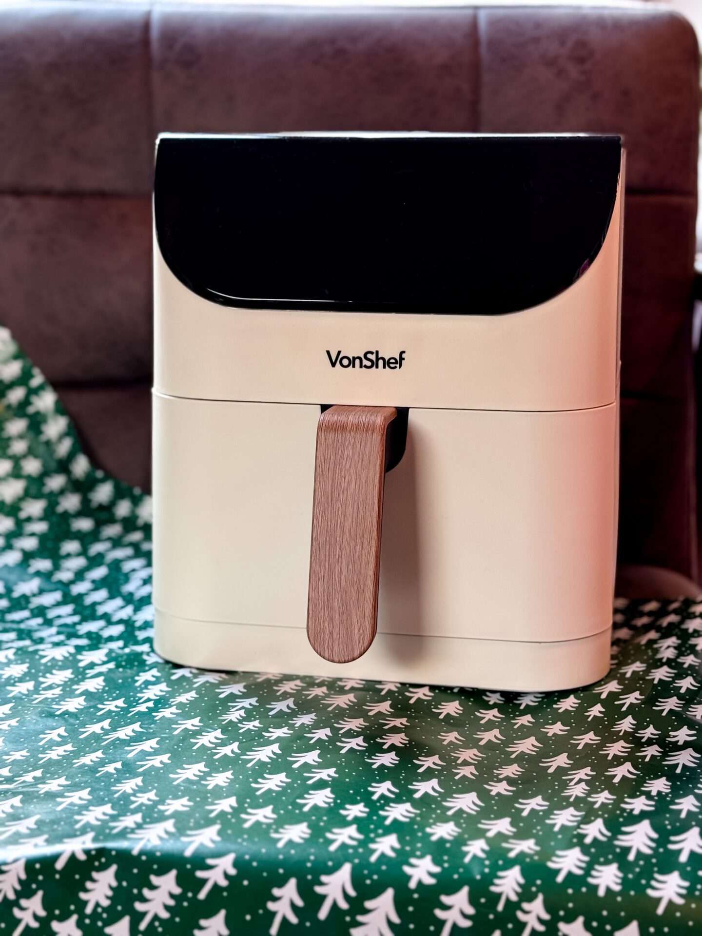 cream vonshef air fryer on green and white christmas tree wrapping paper