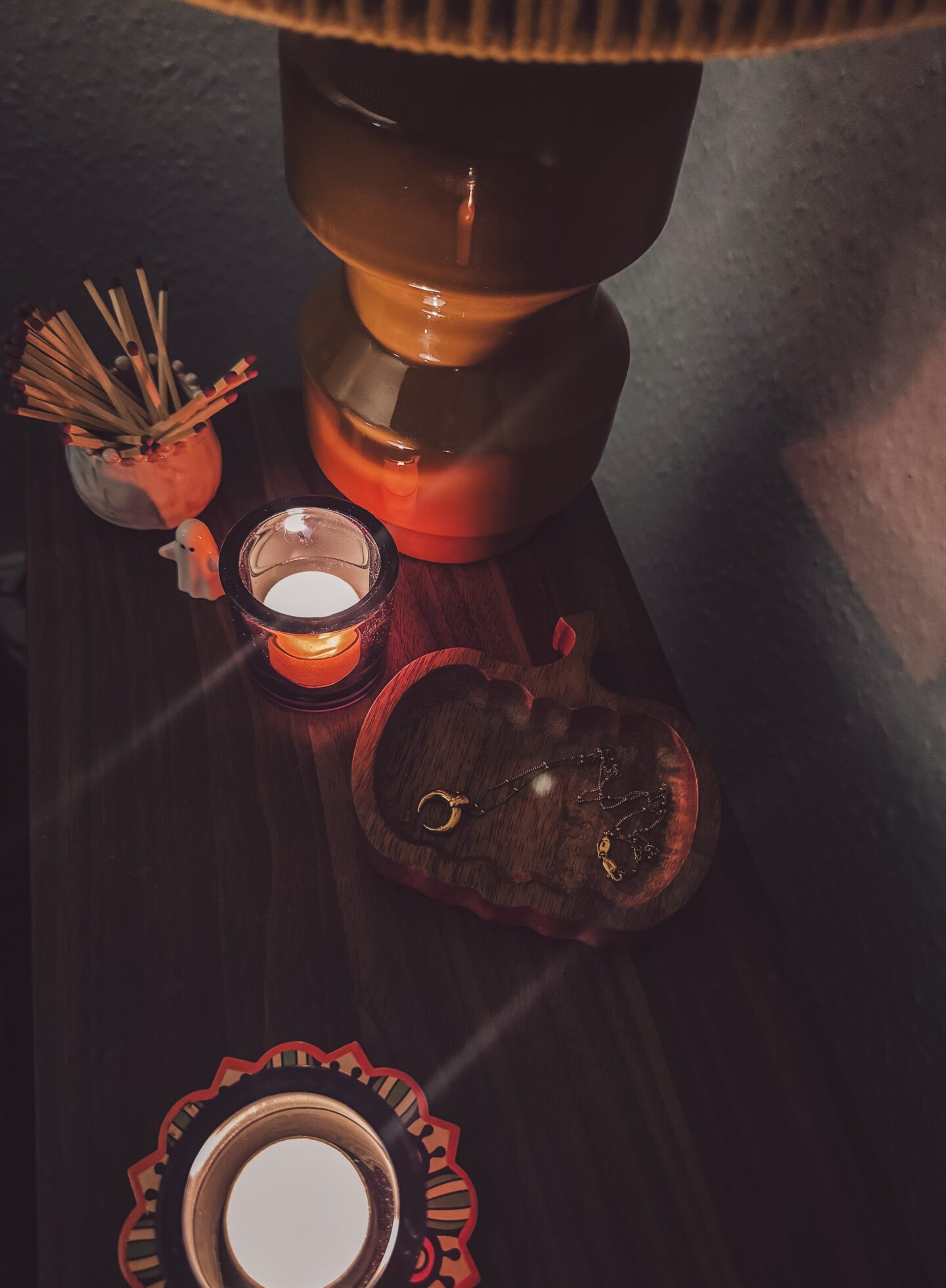 cosy lounge table with lamp, candle, matches an d wooden tray