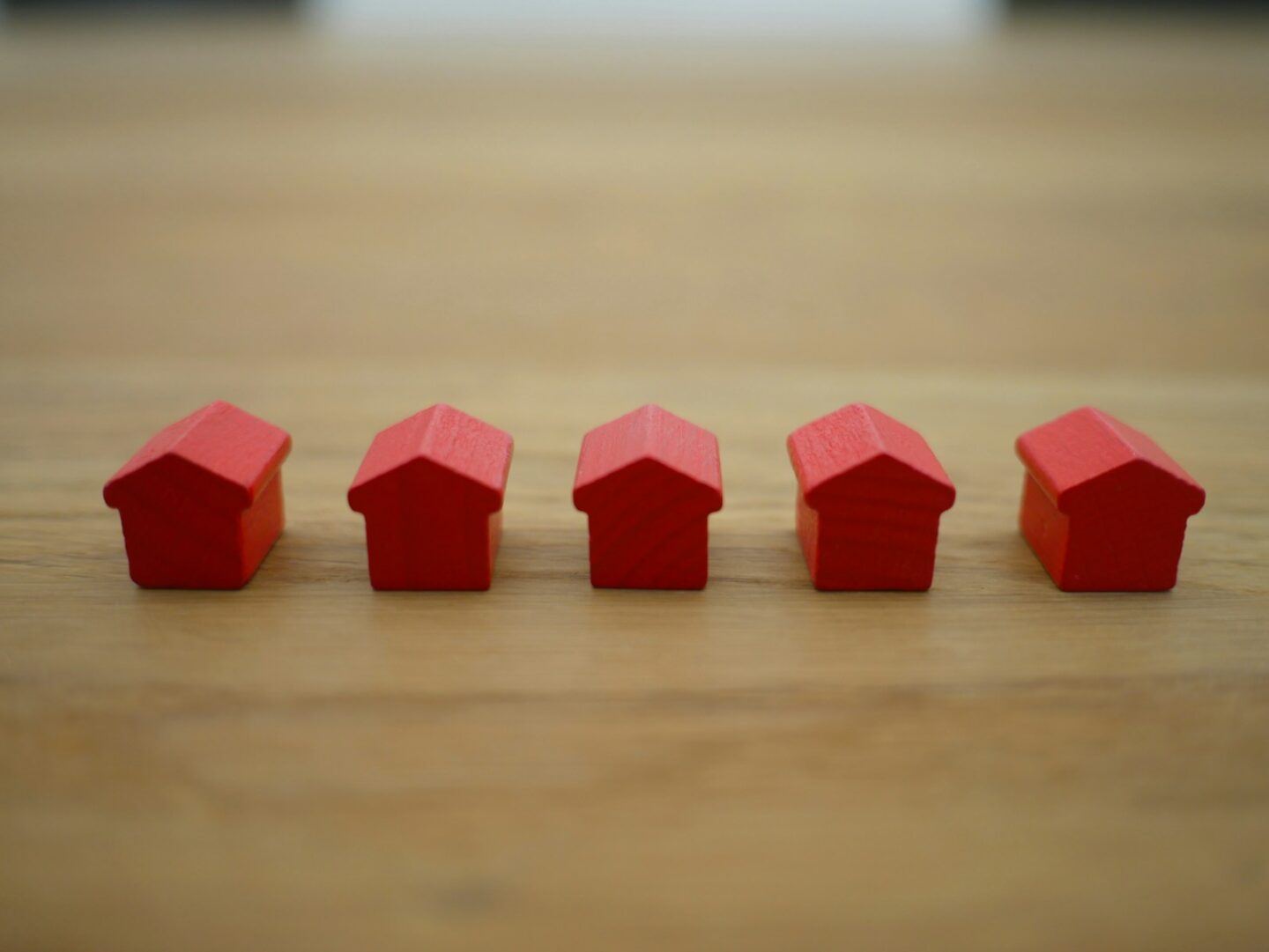 red wooden houses on brown wooden table