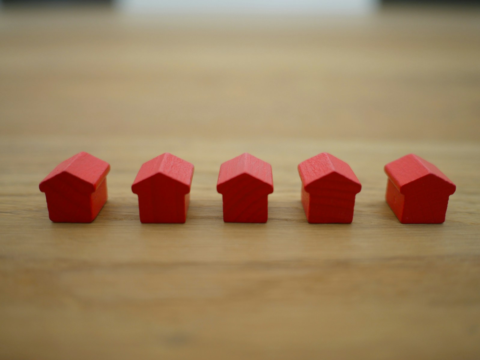 red wooden houses on brown wooden table