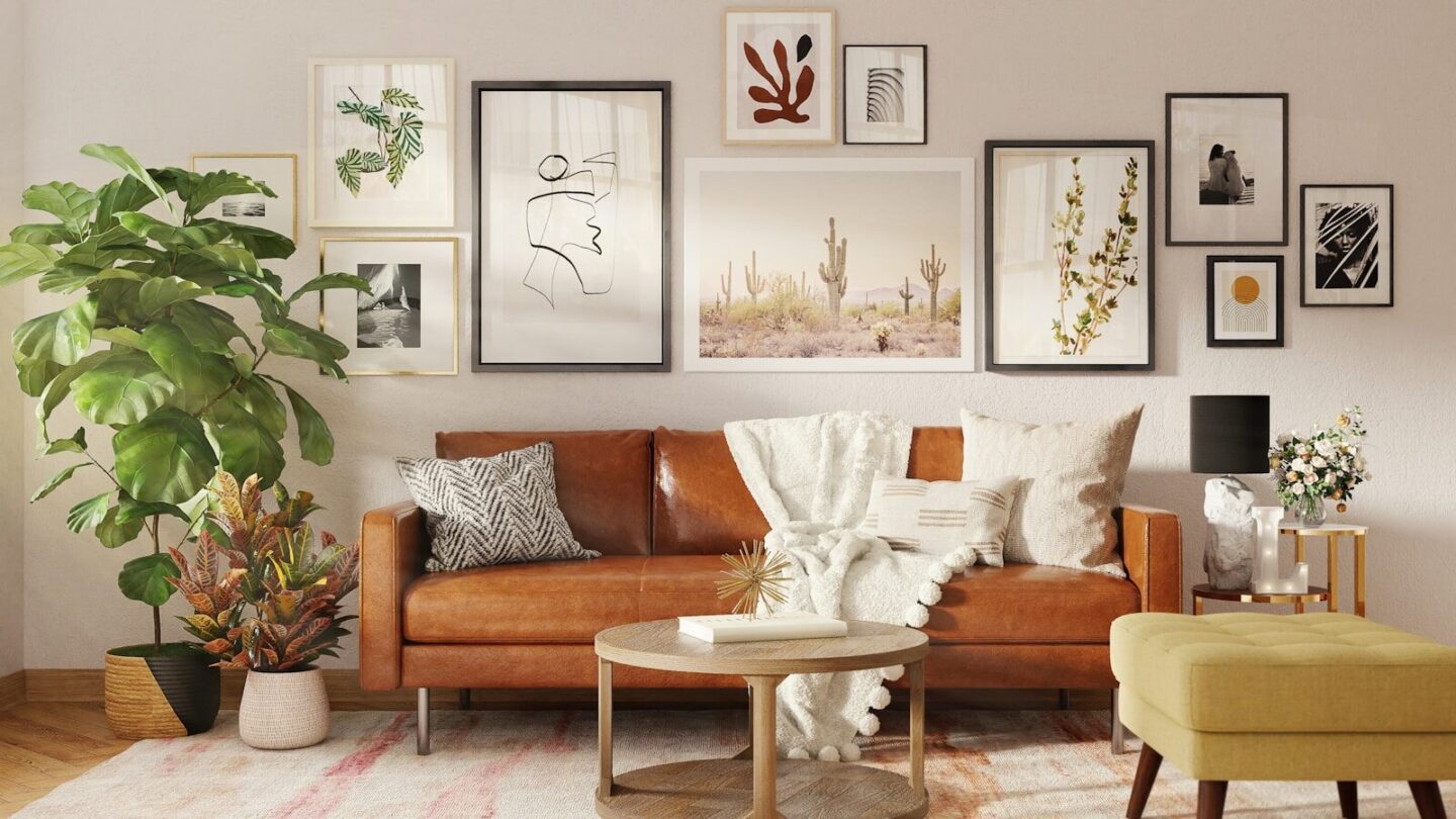 brown wooden framed padded armchair in lounge with lots of framed art on the walls