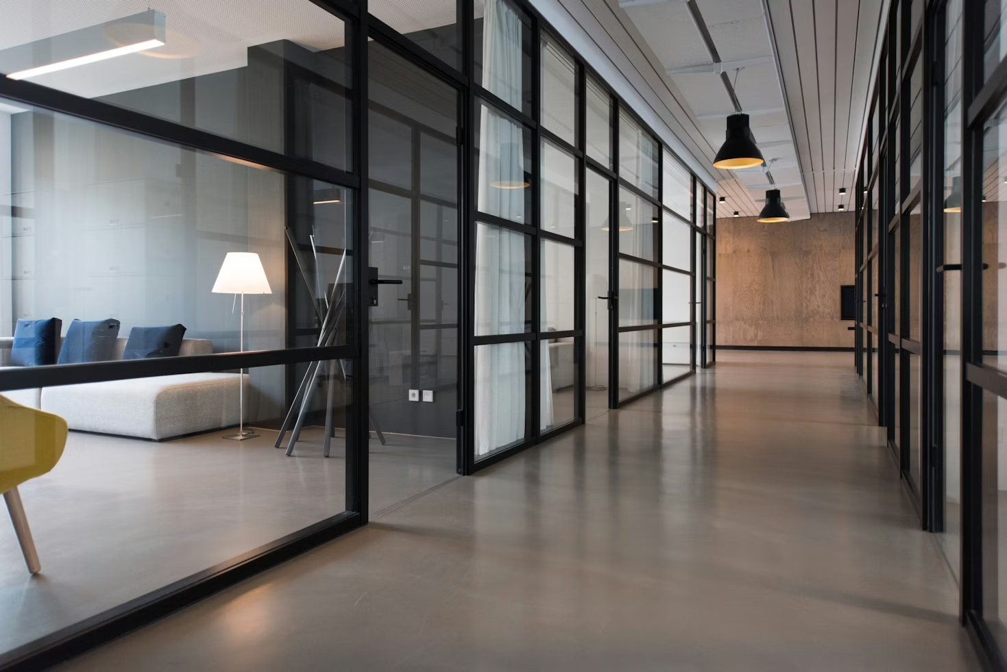 large office with big open windows with black frames