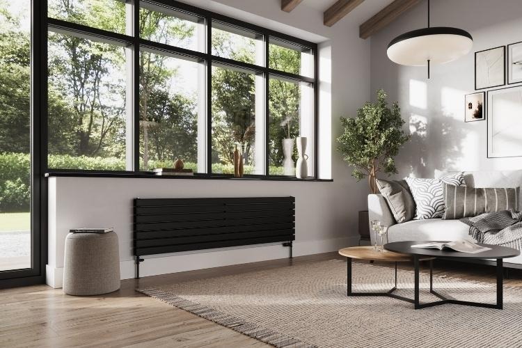 living room with black radiator and large window