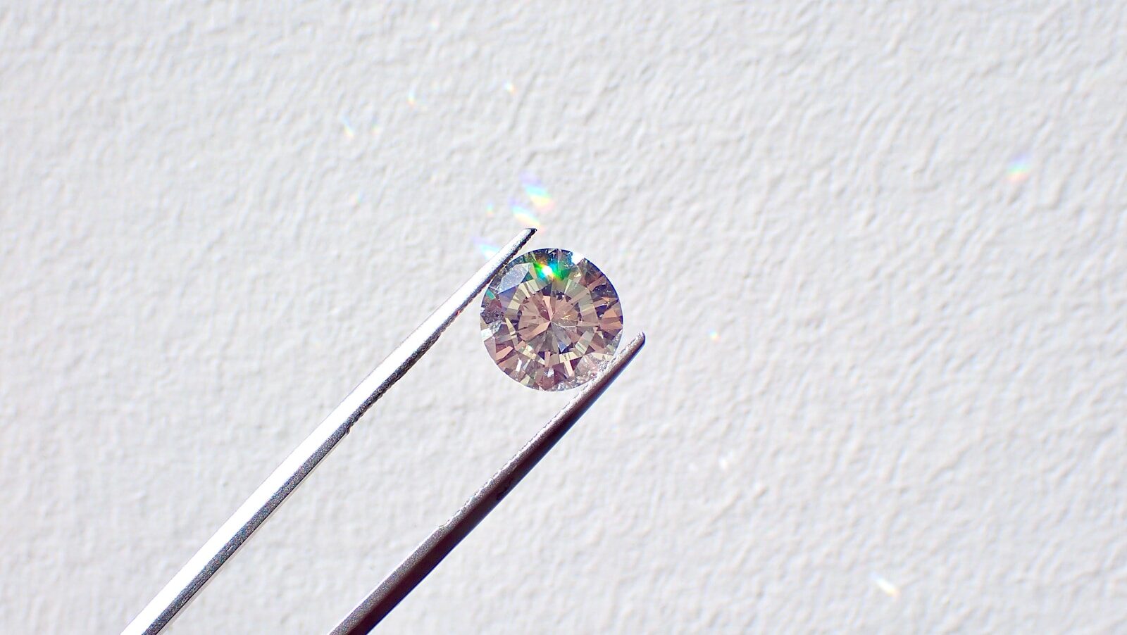 diamond between tweezers