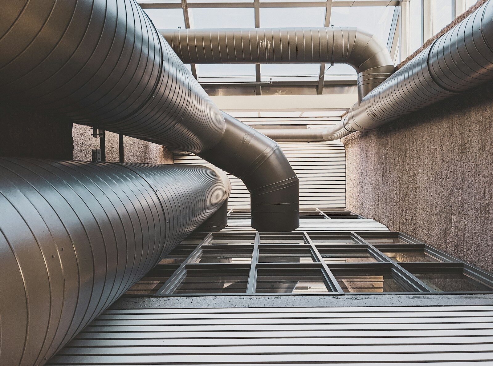 large silver metal pipes in building