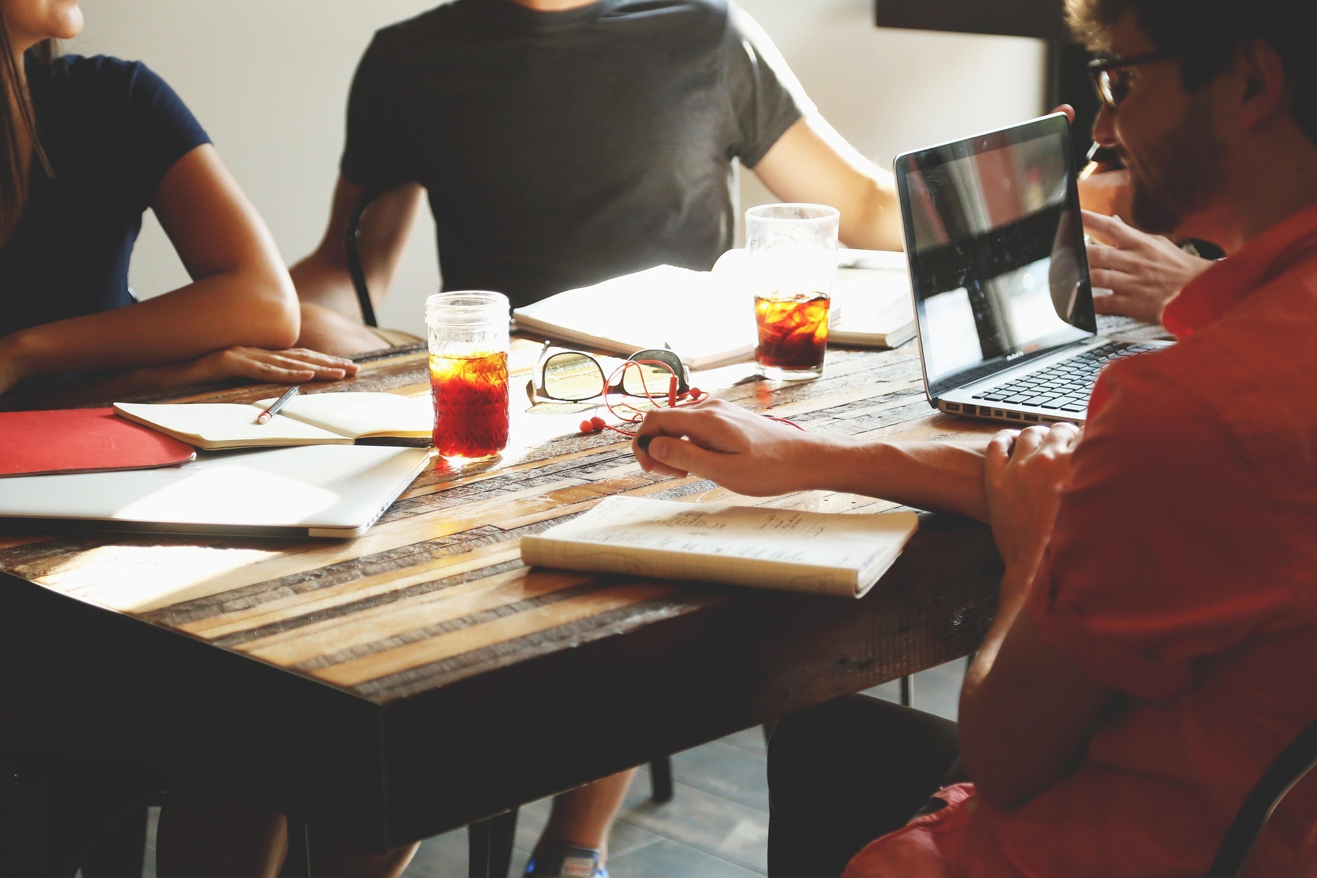 people sitting around a table in a meeting