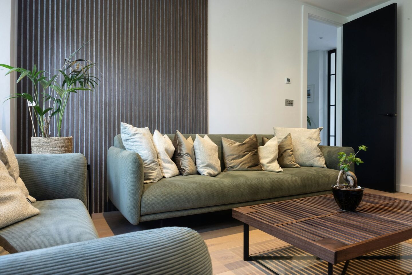 lounge with sofas with lots of cushions on 
