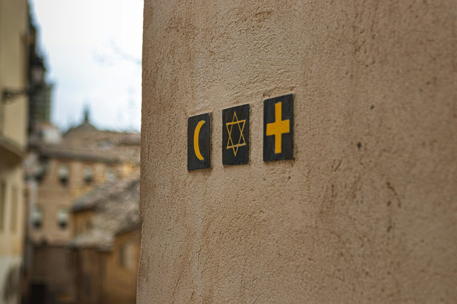 religious signs on wall of building