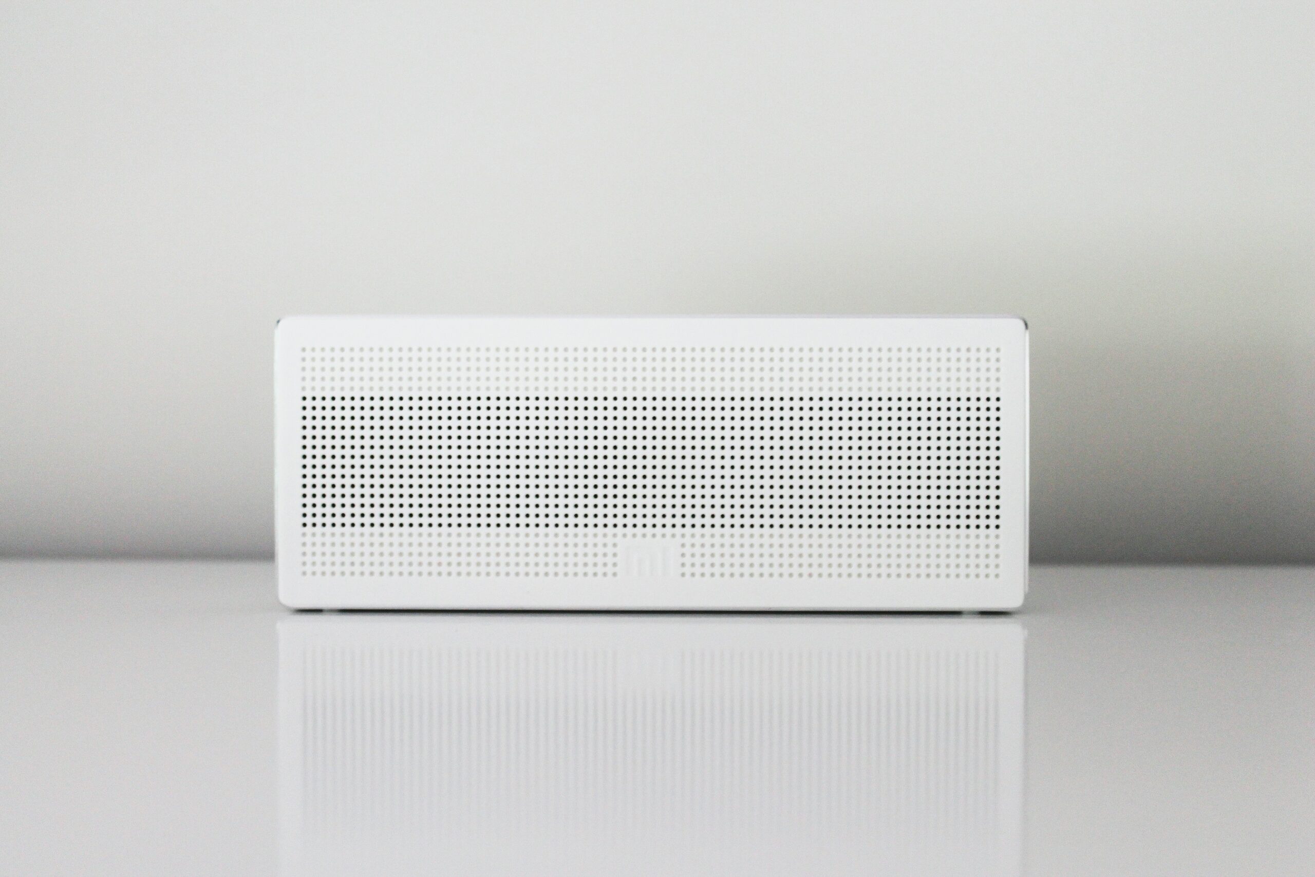 white air conditioning unit on white wall