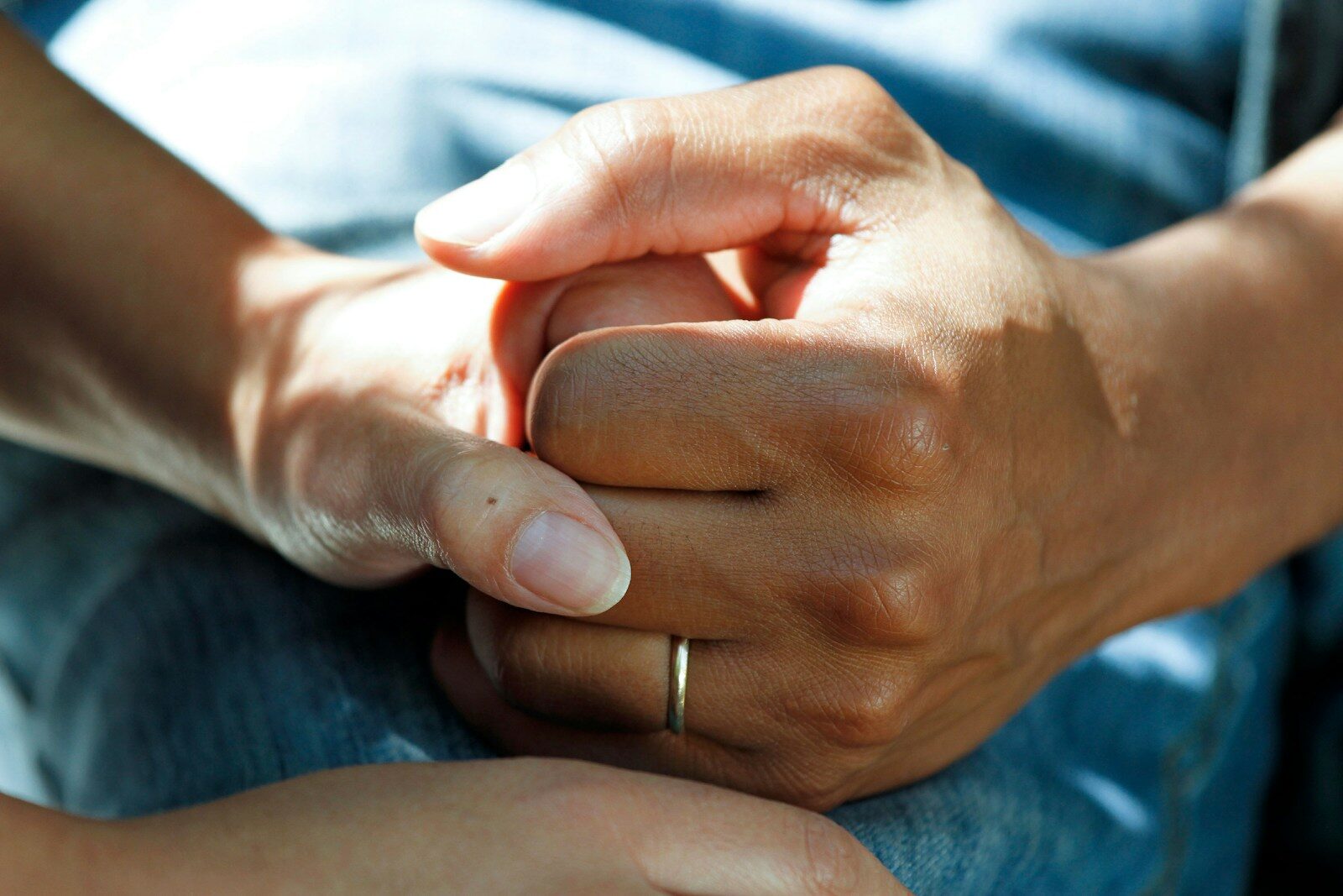 personholding onto hand of another person