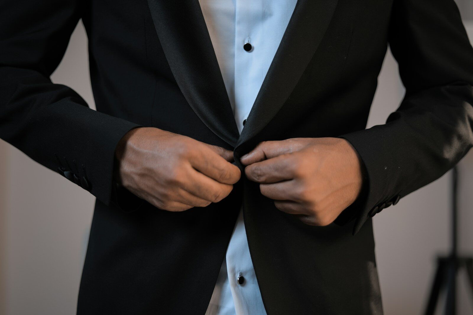 man wearing black suit jacket