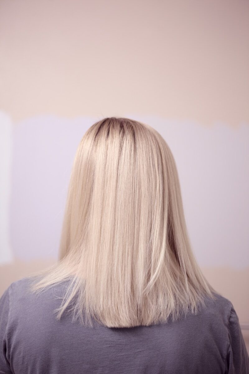 woman from the back with straight blonde hair