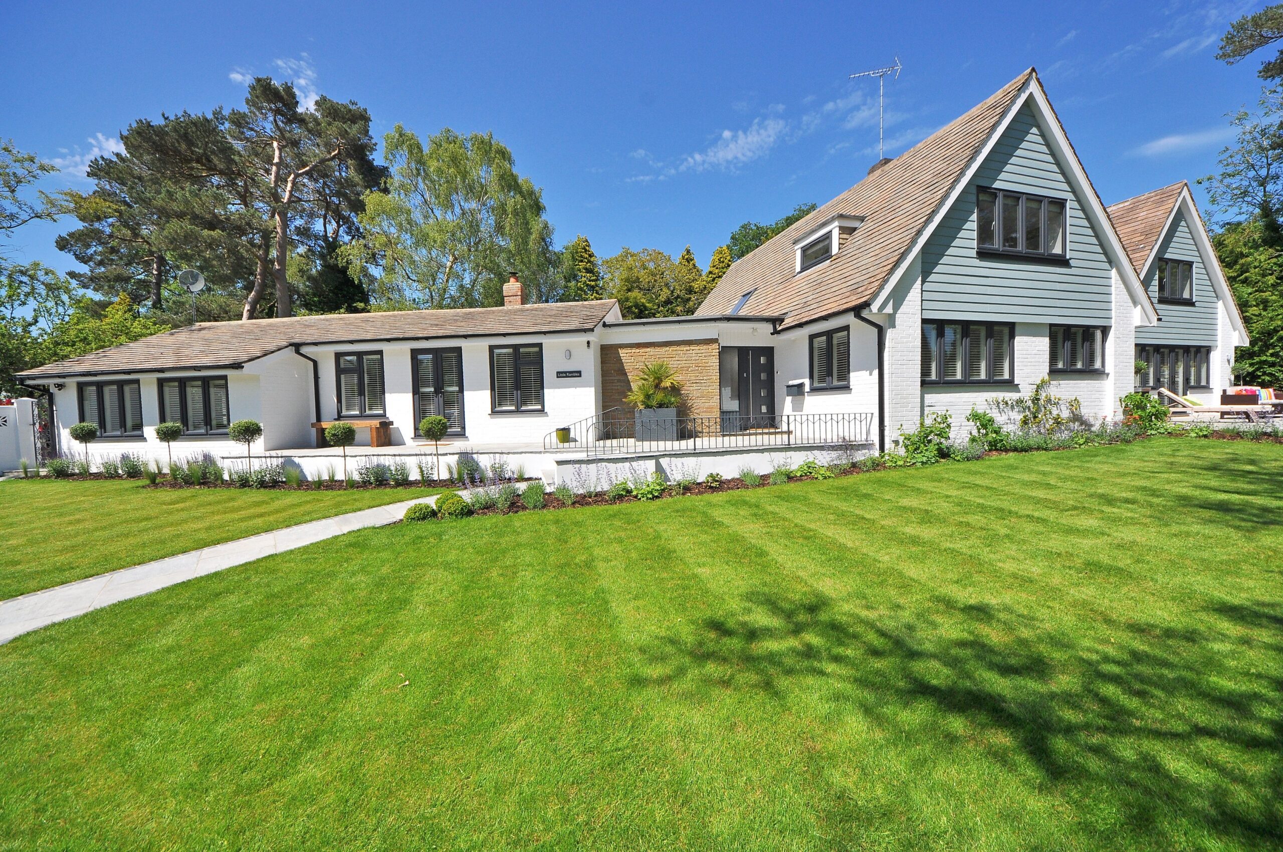large white house with lawn around it