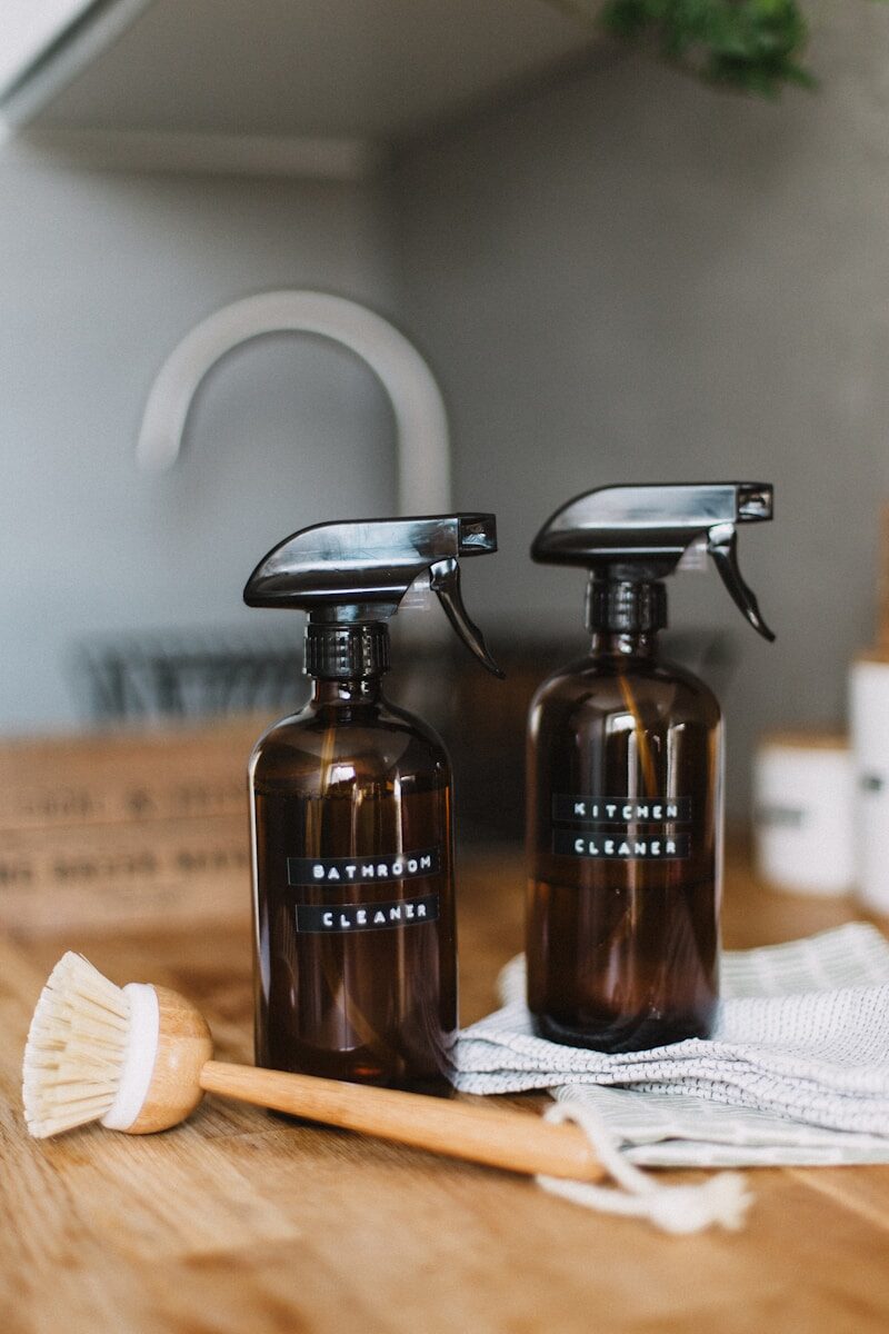 two brown spray bottles on kitchen worktop