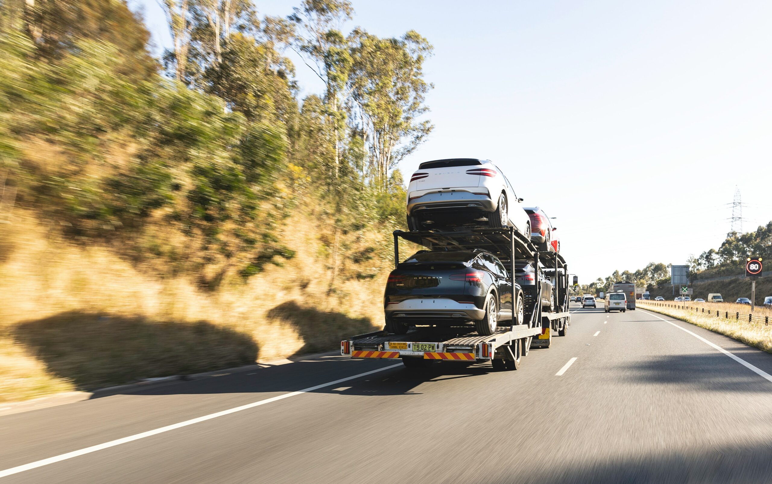 a car transporter full of cars on motorway