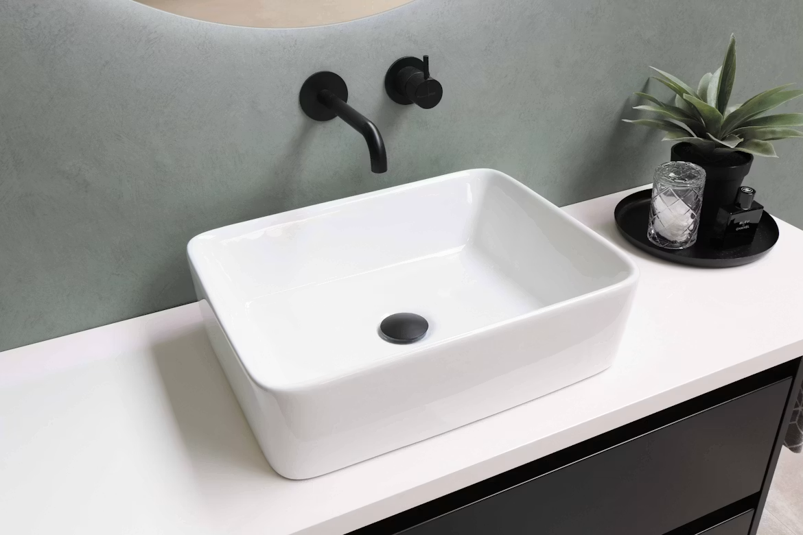 white bathroom sink wotj black taps and plug