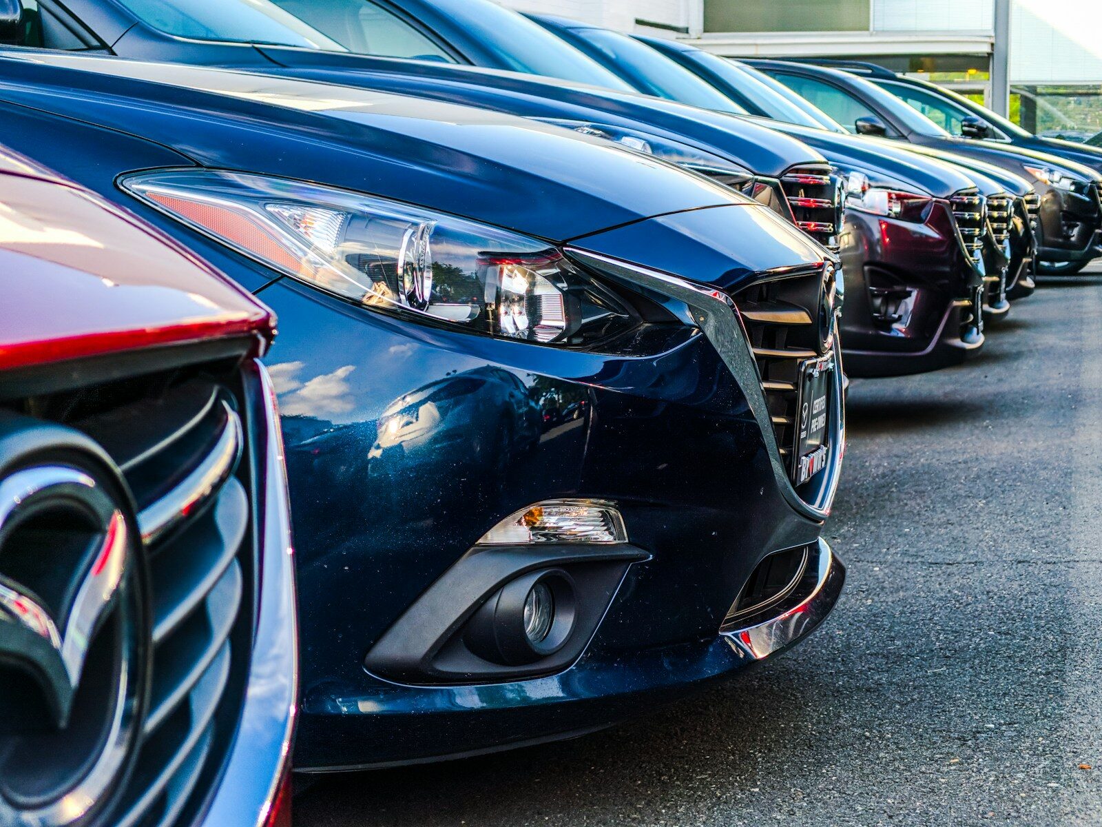 row of parked cars up close