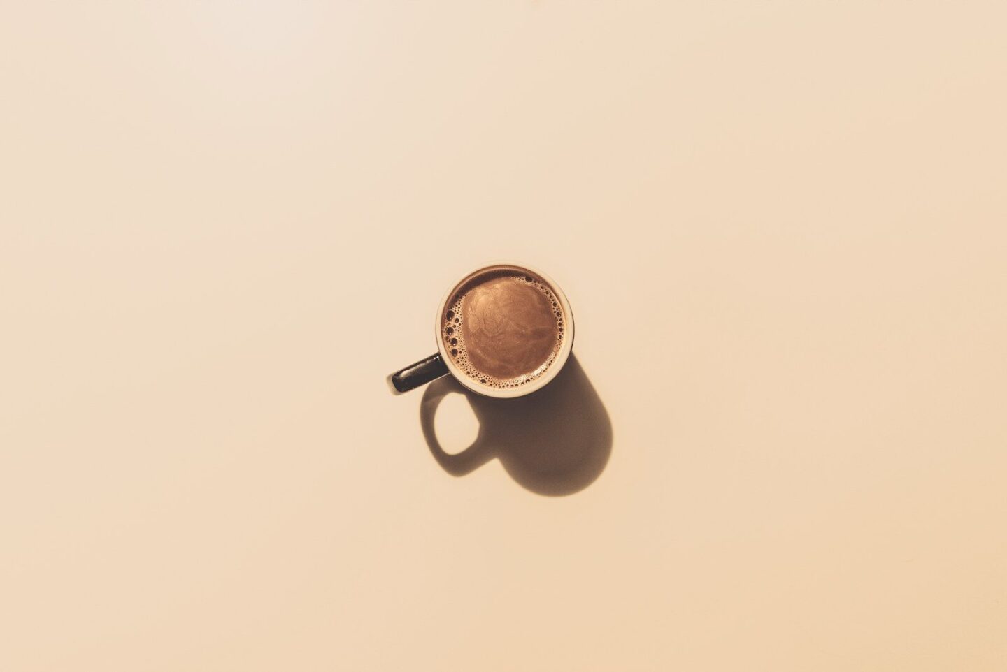 mug of coffee on plain surface