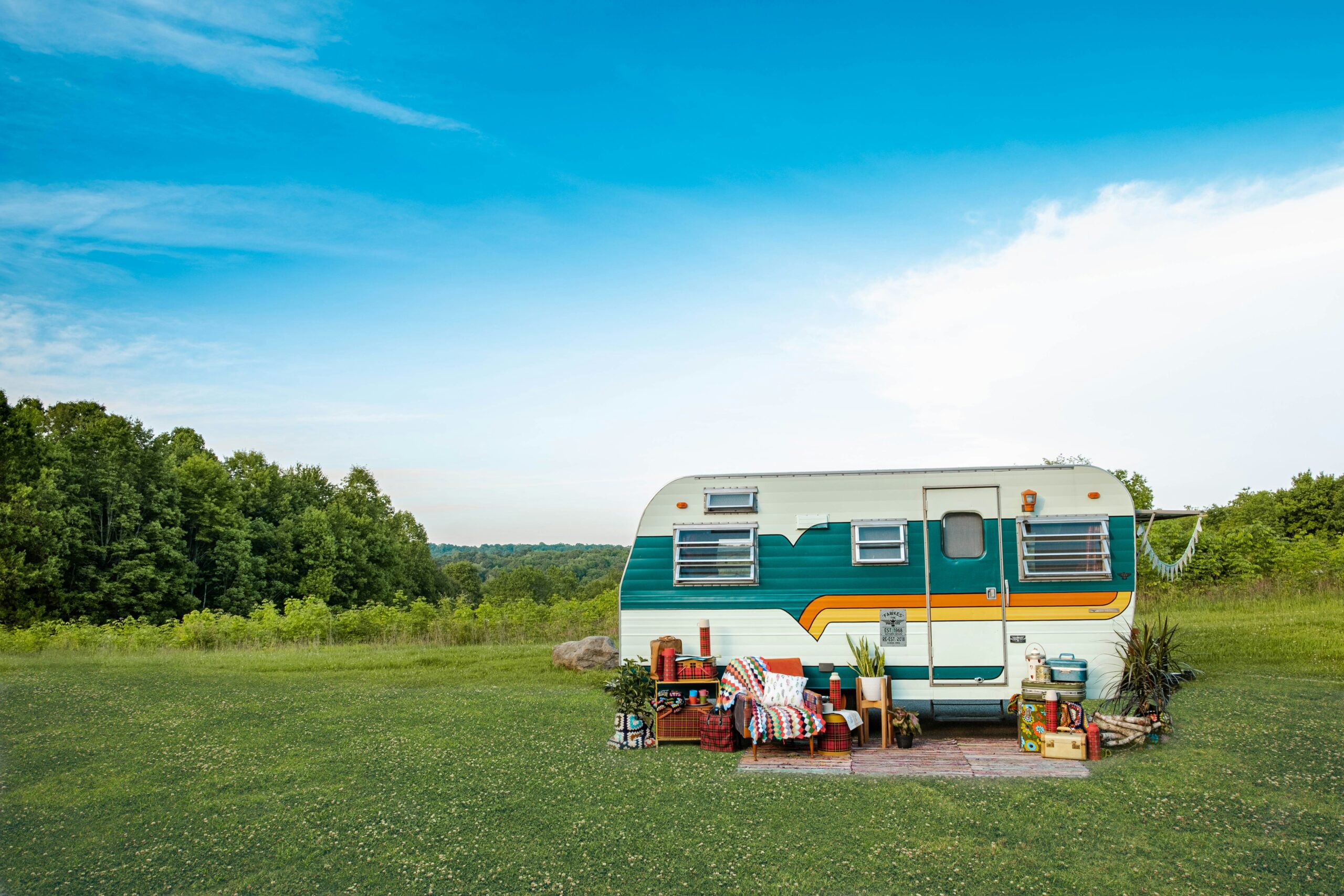 brightly-coloured caravan on grass field